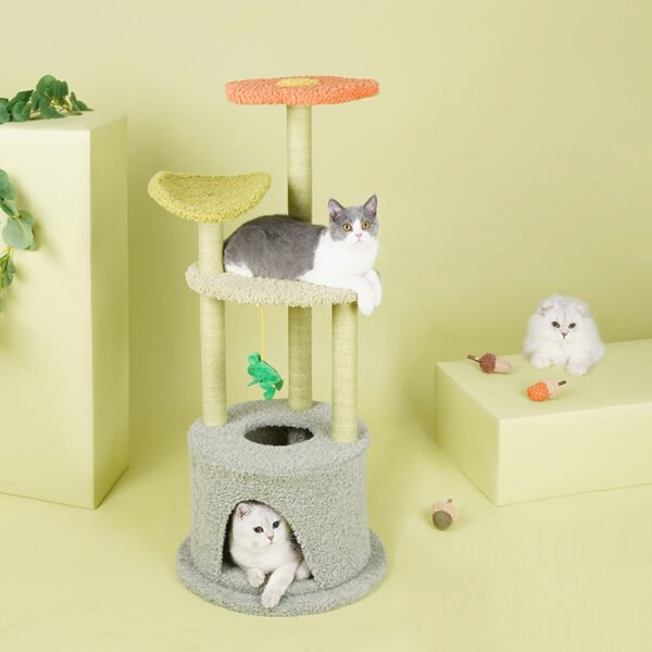 Two cats in a cat tree, all the time cat by a cat tree